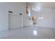 Bright living room with high ceilings, open staircase, and neutral color palette at 787 Craigmark Ct, Henderson, NV 89002