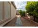 Stone pathway in the side yard with desert landscaping at 787 Craigmark Ct, Henderson, NV 89002