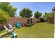 Well-maintained backyard with vibrant artificial turf and decorative landscaping, ideal for outdoor enjoyment at 8232 Silver Vine St, North Las Vegas, NV 89085