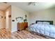 Bedroom with laminate floors, natural lighting, and a dresser for storage at 8232 Silver Vine St, North Las Vegas, NV 89085