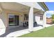 Charming covered patio with a ceiling fan and sliding glass doors, seamlessly blending indoor and outdoor living at 8232 Silver Vine St, North Las Vegas, NV 89085