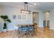 Cozy dining area with hardwood floors, neutral walls, and modern lighting offering a relaxed atmosphere at 8232 Silver Vine St, North Las Vegas, NV 89085