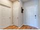 Entryway featuring a wood floor, neutral paint, and paneled interior and exterior doors at 8232 Silver Vine St, North Las Vegas, NV 89085