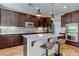 The kitchen showcases an island with bar seating, stainless steel appliances, and plenty of cabinet space at 8232 Silver Vine St, North Las Vegas, NV 89085