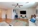 Spacious living room featuring hardwood floors, neutral paint, and a ceiling fan at 8232 Silver Vine St, North Las Vegas, NV 89085