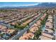 A scenic aerial view capturing a large community with tree-lined streets and well-kept homes at 8504 W Gilmore Ave, Las Vegas, NV 89129