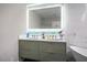 Bathroom vanity with double sinks, modern mirror, and decorative accents at 8504 W Gilmore Ave, Las Vegas, NV 89129