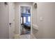 A view into the light-filled bedroom featuring french doors and a ceiling fan at 8504 W Gilmore Ave, Las Vegas, NV 89129