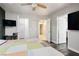 Bedroom with a television and doors leading to other rooms at 8504 W Gilmore Ave, Las Vegas, NV 89129