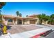 Inviting single-story home with a brick driveway and attached two-car garage at 8504 W Gilmore Ave, Las Vegas, NV 89129