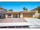 Charming single-story home with a well-manicured front yard and a two-car garage at 8504 W Gilmore Ave, Las Vegas, NV 89129