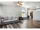 Comfortable living room featuring hardwood floors and an adjacent kitchen view at 8504 W Gilmore Ave, Las Vegas, NV 89129