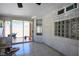 Outdoor patio with glass block window features and sliding glass door access at 8504 W Gilmore Ave, Las Vegas, NV 89129