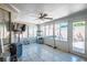Spacious patio area enclosed with bright windows and tiled flooring at 8504 W Gilmore Ave, Las Vegas, NV 89129