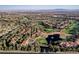 Gorgeous aerial photo of a golf course community, highlighting beautiful homes and a scenic water feature at 9000 Opus Dr, Las Vegas, NV 89117