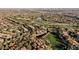 Aerial view of a residential neighborhood with mature trees and a golf course at 9000 Opus Dr, Las Vegas, NV 89117