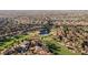 Expansive aerial view of a residential golf community showcasing the scenic landscape at 9000 Opus Dr, Las Vegas, NV 89117