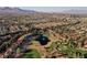 Wide aerial perspective of a gated golf community, showcasing lush landscaping at 9000 Opus Dr, Las Vegas, NV 89117