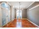 Elegant dining room featuring hardwood floors, a chandelier, and built-in bookshelves at 9000 Opus Dr, Las Vegas, NV 89117