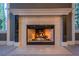 Close up of an elegant fireplace with a marble mantel and decorative tile surround at 9000 Opus Dr, Las Vegas, NV 89117