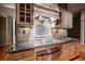 Gourmet kitchen featuring sleek appliances, custom cabinetry, and granite countertops at 9000 Opus Dr, Las Vegas, NV 89117