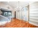 Elegant living room featuring hardwood floors, chandelier lighting, and built-in shelving units at 9000 Opus Dr, Las Vegas, NV 89117