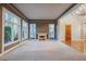 Spacious living room with ample natural light, plush carpet, and a cozy fireplace at 9000 Opus Dr, Las Vegas, NV 89117