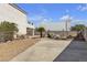 Backyard featuring a pool, fire pit, desert landscaping, and extended concrete patio at 9290 S Cool Creek Ave, Las Vegas, NV 89147
