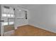 Well-lit bedroom with light walls and wood-look flooring, showcasing open doorway at 9290 S Cool Creek Ave, Las Vegas, NV 89147
