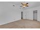 Bedroom featuring ceiling fan, closet, and neutral carpet for a cozy atmosphere at 9290 S Cool Creek Ave, Las Vegas, NV 89147