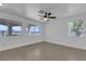 Bright bedroom with ceiling fan, multiple windows providing natural light and neutral walls at 9290 S Cool Creek Ave, Las Vegas, NV 89147