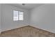 Bedroom featuring a window and neutral carpet for a serene atmosphere at 9290 S Cool Creek Ave, Las Vegas, NV 89147