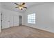 Cozy bedroom with a ceiling fan and closet, showcasing a tranquil space at 9290 S Cool Creek Ave, Las Vegas, NV 89147