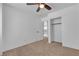Carpeted bedroom featuring doorway to open hall and bedroom at 9290 S Cool Creek Ave, Las Vegas, NV 89147