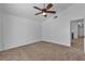 Bedroom with carpeted floors, a ceiling fan, and lots of natural light at 9290 S Cool Creek Ave, Las Vegas, NV 89147