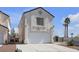 Charming home with a two-car garage and stucco exterior, with palm trees dotting the neighborhood at 9290 S Cool Creek Ave, Las Vegas, NV 89147