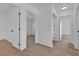 Upstairs hallway with multiple doors leading to bedrooms and bathrooms at 9290 S Cool Creek Ave, Las Vegas, NV 89147