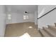 Bright living room with tile flooring, staircase and abundant natural light from multiple windows at 9290 S Cool Creek Ave, Las Vegas, NV 89147