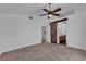 Main bedroom featuring a ceiling fan and a barn door leading to the bathroom at 9290 S Cool Creek Ave, Las Vegas, NV 89147