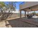 Outdoor patio area with ceiling fans, dining table, and view of the yard at 9290 S Cool Creek Ave, Las Vegas, NV 89147