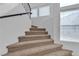 Carpeted staircase with white walls and lots of natural light from nearby windows at 9290 S Cool Creek Ave, Las Vegas, NV 89147