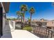 Balcony featuring scenic views of surrounding houses, trees, and distant mountain range at 9501 Balatta Canyon Ct, Las Vegas, NV 89144