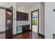 Wet bar featuring dark cabinetry, a wine refrigerator, and a beautiful outdoor view at 9501 Balatta Canyon Ct, Las Vegas, NV 89144