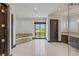 Bathroom showcasing tub, mountain views, and tile flooring at 9501 Balatta Canyon Ct, Las Vegas, NV 89144