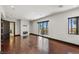 Large room featuring hardwood floors, a fireplace, access to a balcony, and an adjacent bath at 9501 Balatta Canyon Ct, Las Vegas, NV 89144