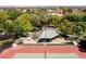 Aerial view of a community pavilion with picnic tables, palm trees, and manicured landscaping at 9501 Balatta Canyon Ct, Las Vegas, NV 89144