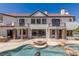 A stunning two-story home featuring a beautiful backyard pool and luxurious patio area at 9501 Balatta Canyon Ct, Las Vegas, NV 89144