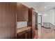 Hallway with wood floors, custom cabinets and countertop, and staircase at 9501 Balatta Canyon Ct, Las Vegas, NV 89144