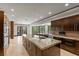 Elegant kitchen boasts a central island, designer countertops, and stainless steel appliances at 9501 Balatta Canyon Ct, Las Vegas, NV 89144