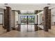 Spacious living room with stone pillars, fireplace and sliding glass doors to the pool and patio area at 9501 Balatta Canyon Ct, Las Vegas, NV 89144